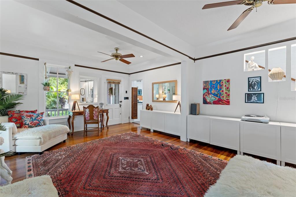 429 Scotland Street Dunedin, FL 34698 - Photo 13 of 78 a living room with furniture and wooden floor