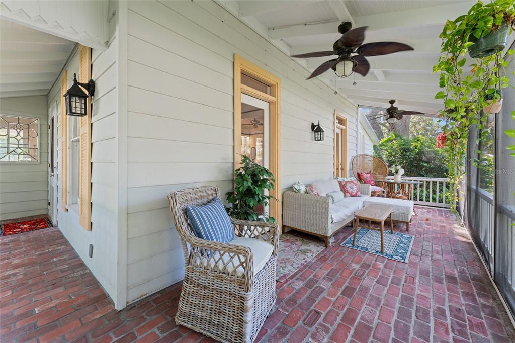 429 Scotland Street Dunedin, FL 34698 - Photo 14 of 78 a view of a deck with chair and table or wooden floor