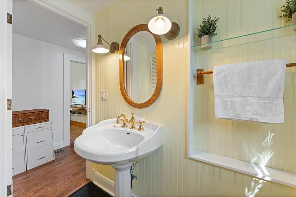 429 Scotland Street Dunedin, FL 34698 - Photo 27 of 78 a bathroom with a sink mirror and a toilet