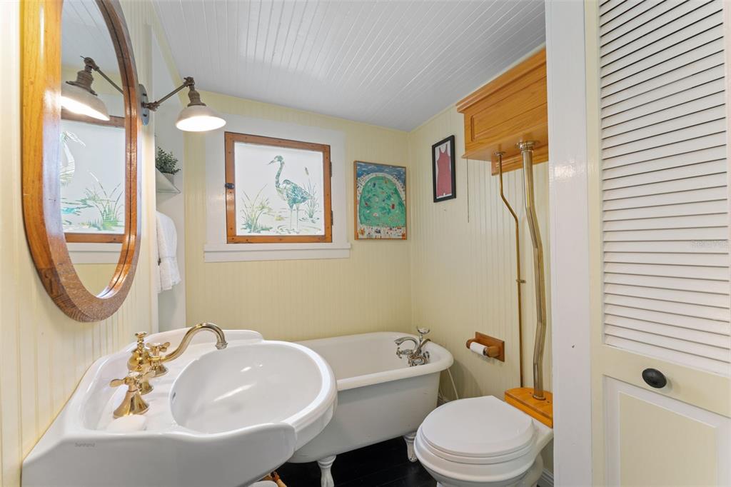 429 Scotland Street Dunedin, FL 34698 - Photo 28 of 78 a bathroom with a sink toilet and shower