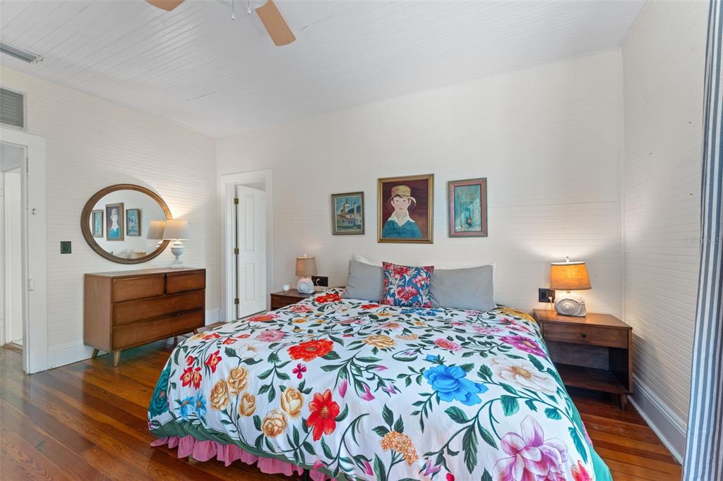 429 Scotland Street Dunedin, FL 34698 - Photo 33 of 78 a bedroom with a bed and wooden floor