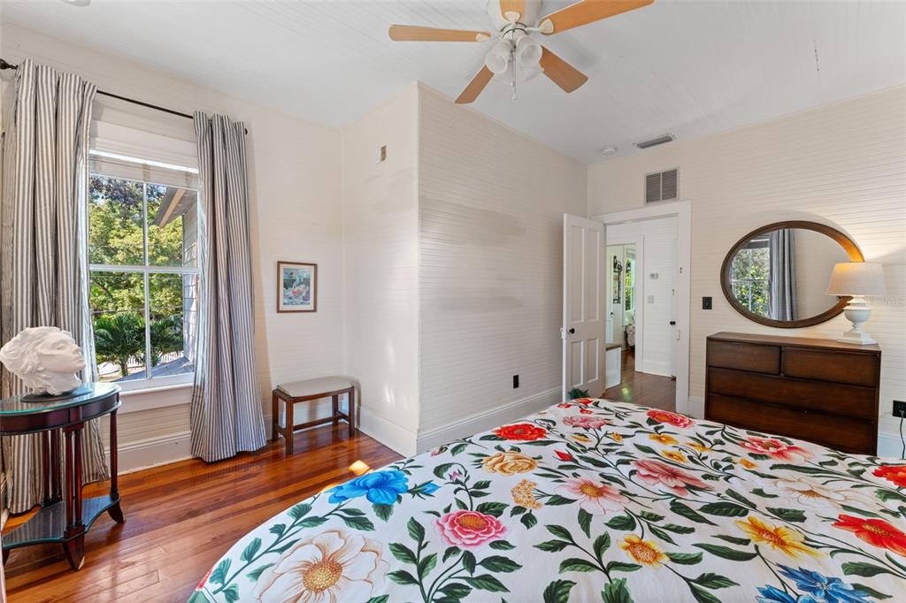 429 Scotland Street Dunedin, FL 34698 - Photo 35 of 78 a bedroom with a bed a dresser and chair