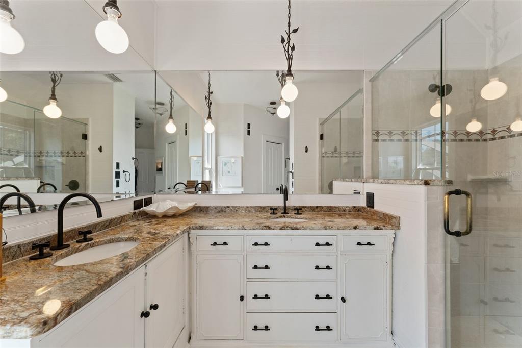 429 Scotland Street Dunedin, FL 34698 - Photo 37 of 78 a bathroom with a granite countertop sink mirror and double