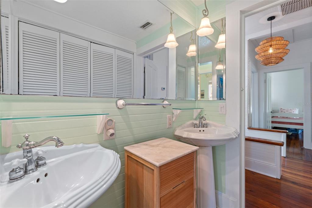 429 Scotland Street Dunedin, FL 34698 - Photo 39 of 78 a bathroom with a sink and a mirror