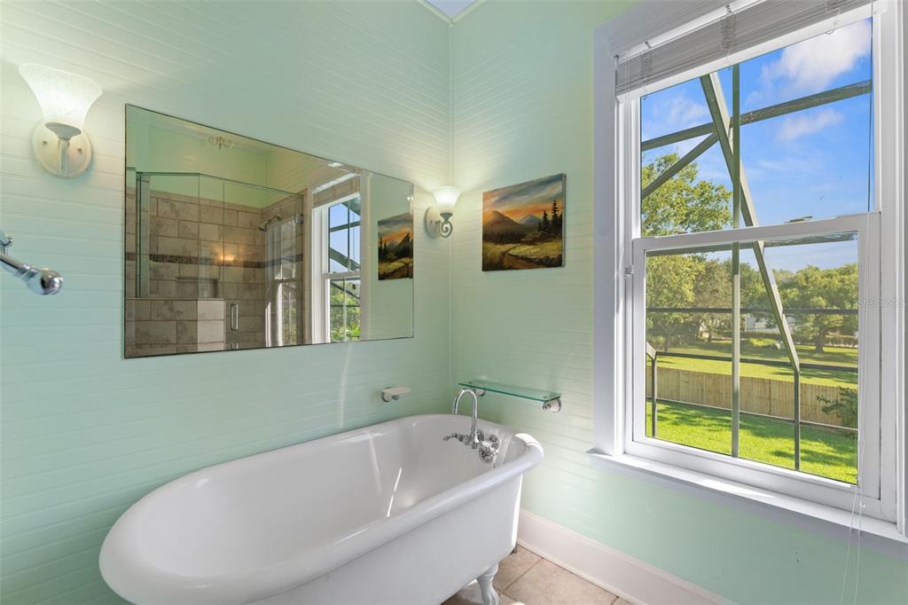 429 Scotland Street Dunedin, FL 34698 - Photo 41 of 78 a bathroom with a bathtub and a window