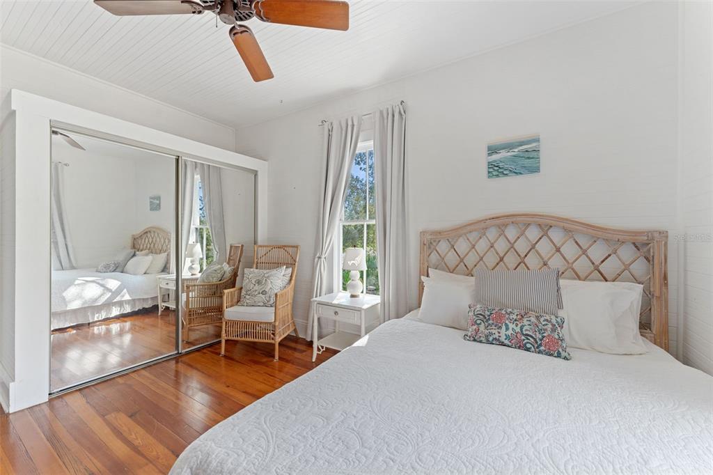 429 Scotland Street Dunedin, FL 34698 - Photo 50 of 78 a bedroom with a bed a window and glass door