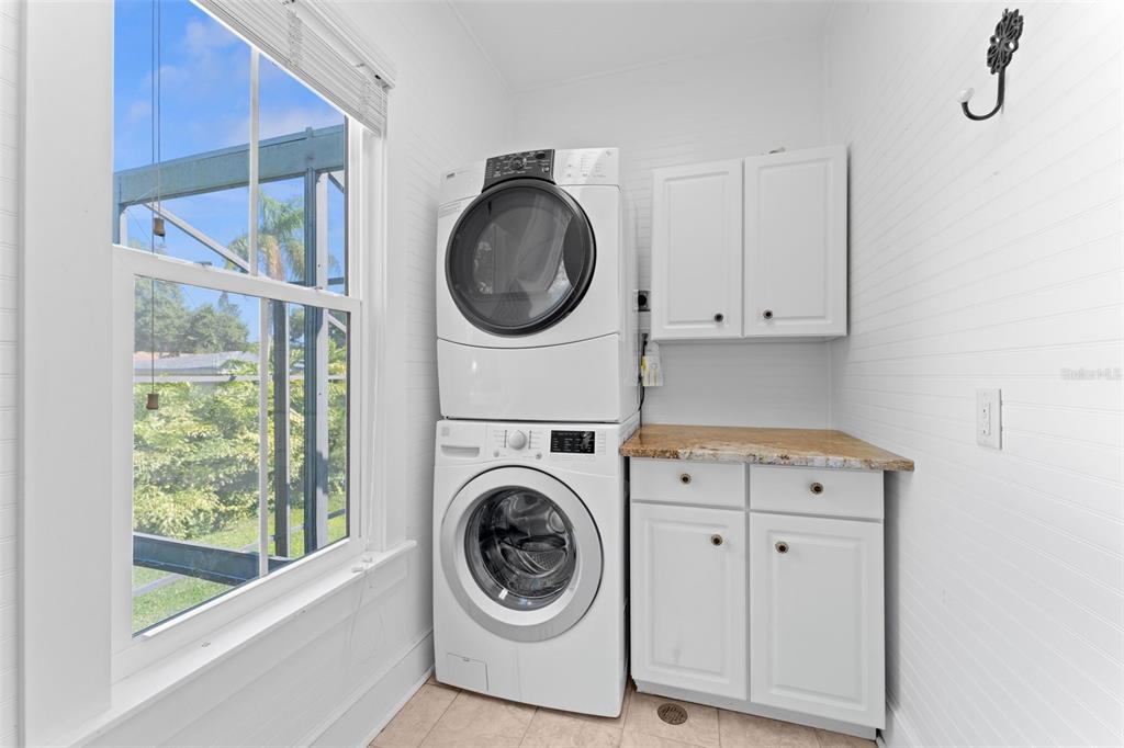 429 Scotland Street Dunedin, FL 34698 - Photo 54 of 78 a view of storage and utility room with washer and dryer