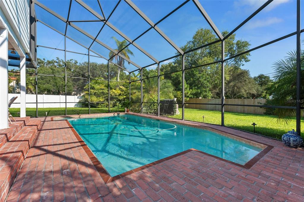 429 Scotland Street Dunedin, FL 34698 - Photo 55 of 78 a view of a backyard with a swimming pool