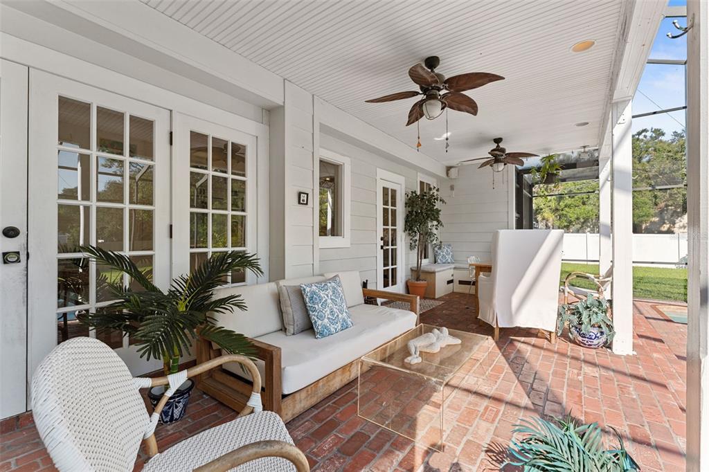 429 Scotland Street Dunedin, FL 34698 - Photo 58 of 78 a living room with furniture ceiling fan and a window