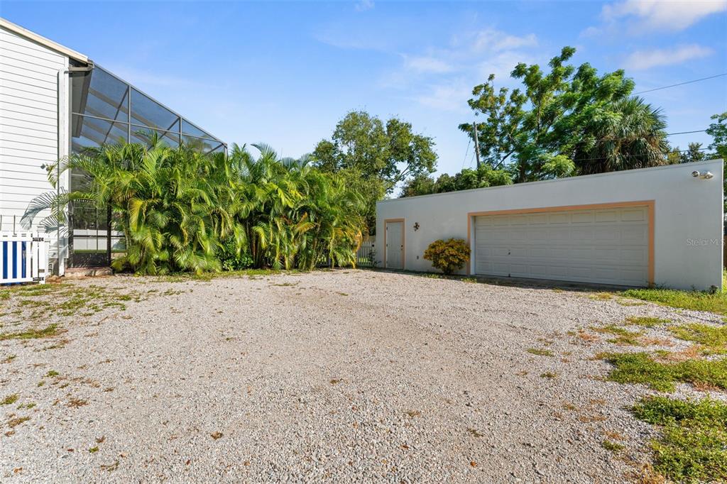 429 Scotland Street Dunedin, FL 34698 - Photo 64 of 78 a view of a house with a yard and garage