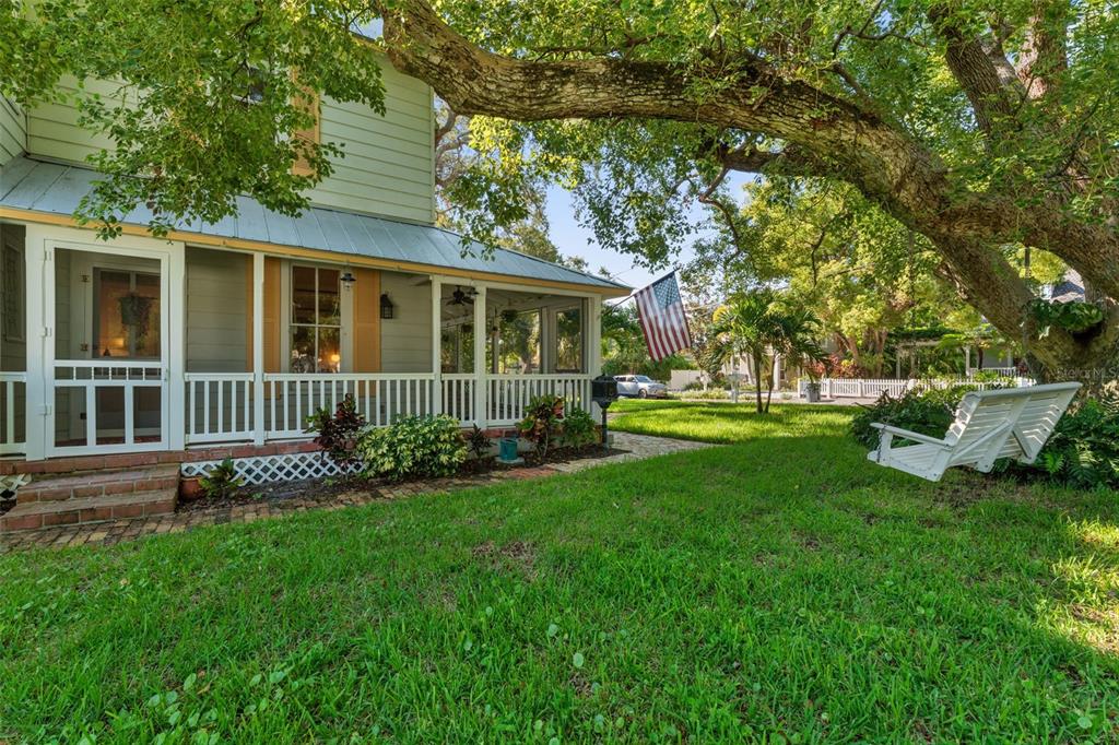 429 Scotland Street Dunedin, FL 34698 - Photo 70 of 78 a front view of a house with a yard and green space