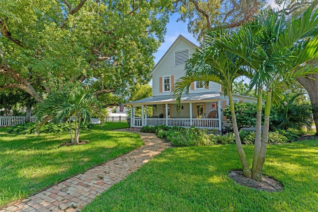 429 Scotland Street Dunedin, FL 34698 - Photo 72 of 78 a front view of a house with a yard
