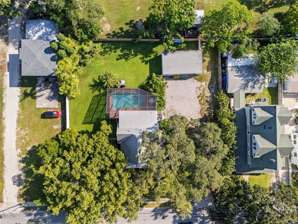 429 Scotland Street Dunedin, FL 34698 - Photo 73 of 78 an aerial view of a house with a garden and lake view