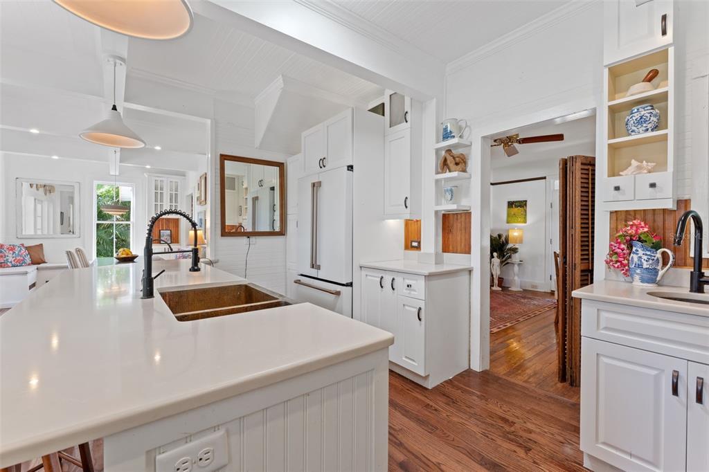 429 Scotland Street Dunedin, FL 34698 - Photo 8 of 78 a kitchen with stainless steel appliances granite countertop a refrigerator and a stove top oven
