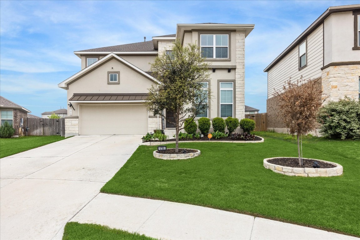 6788 Catania Loop Round Rock, TX 78665 - Photo 1 of 1 a view of a house with a yard and a garage