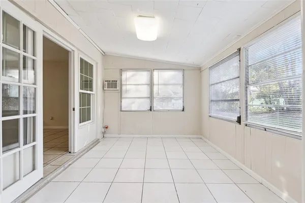 a view of an empty room with a window