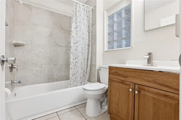 a bathroom with a sink a toilet and a bathtub