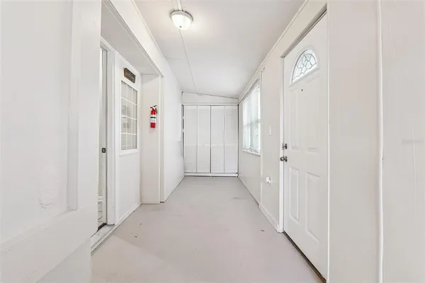 a view of a hallway with white walls