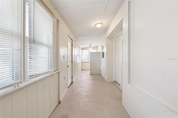a view of a hallway with windows