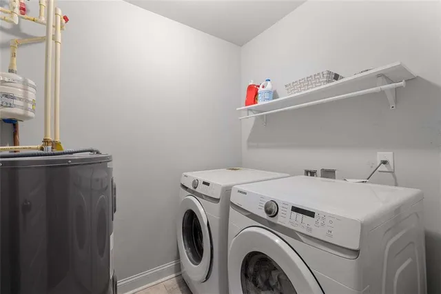 a utility room with dryer and washer