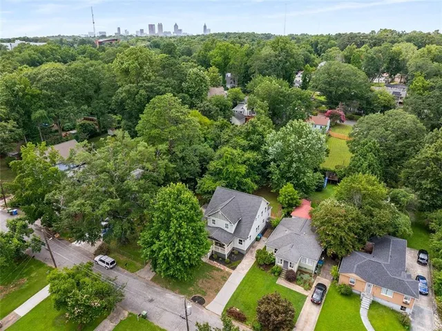 an aerial view of a house with a yard