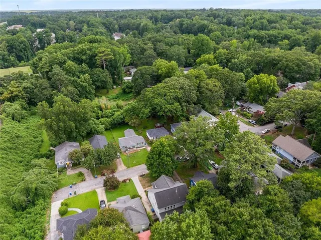 an aerial view of residential house with outdoor space and swimming pool