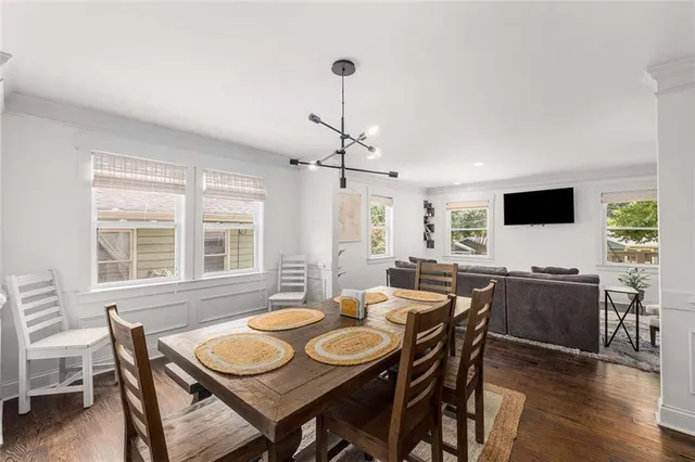 a view of a dining room with furniture window and wooden floor