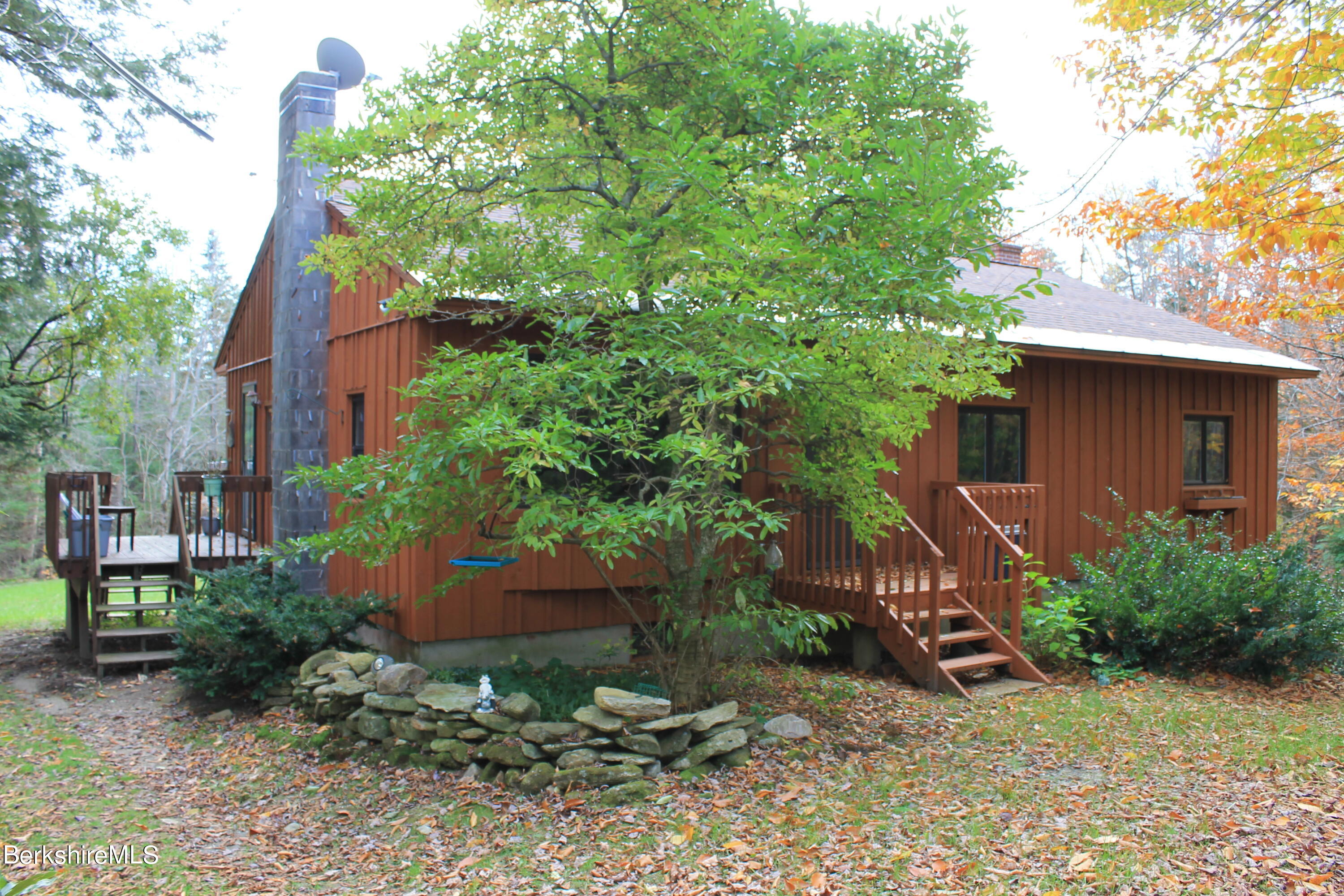 46 East Windsor Road Peru, MA 01235 - Photo 1 of 29 a backyard of a house with plants and tree