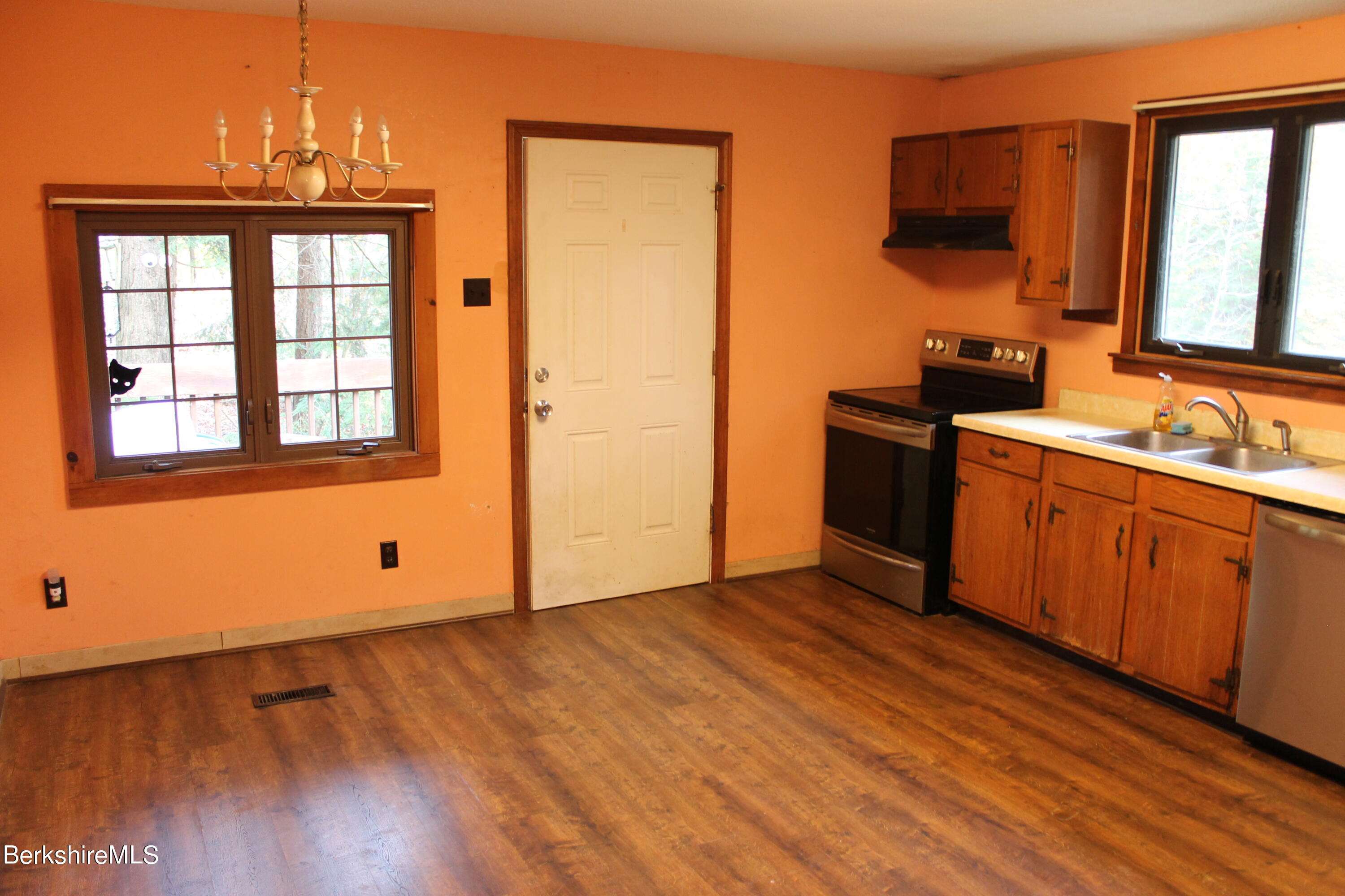 46 East Windsor Road Peru, MA 01235 - Photo 11 of 29 a view of a kitchen with wooden floor and a sink