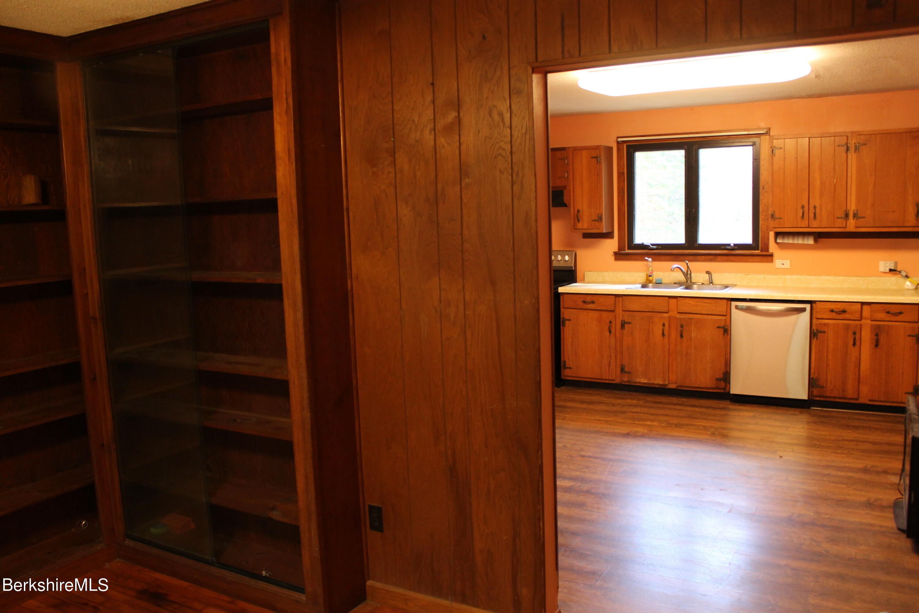 46 East Windsor Road Peru, MA 01235 - Photo 14 of 29 a view of a kitchen with wooden floor and a window