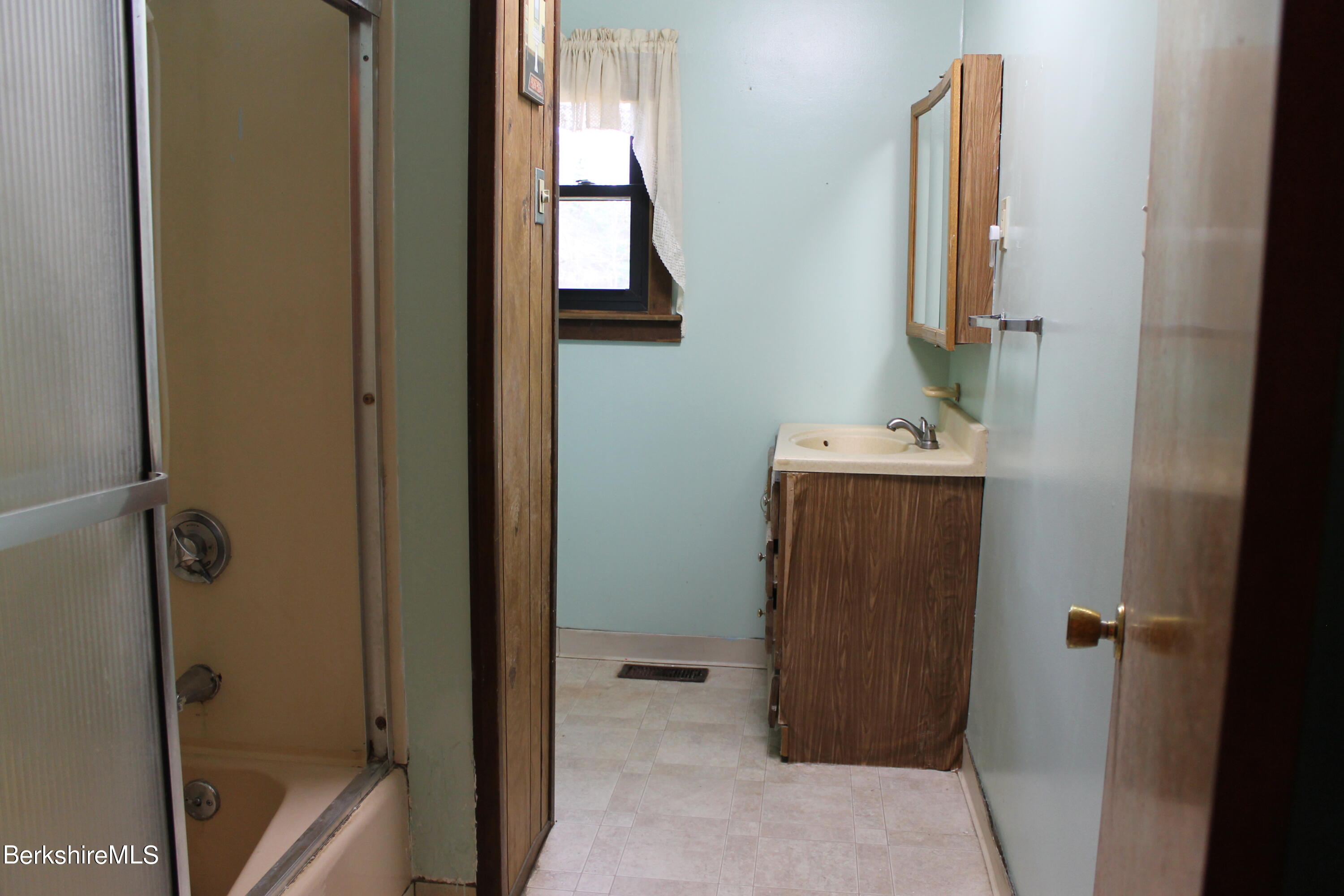 46 East Windsor Road Peru, MA 01235 - Photo 16 of 29 a bathroom with a sink and mirror