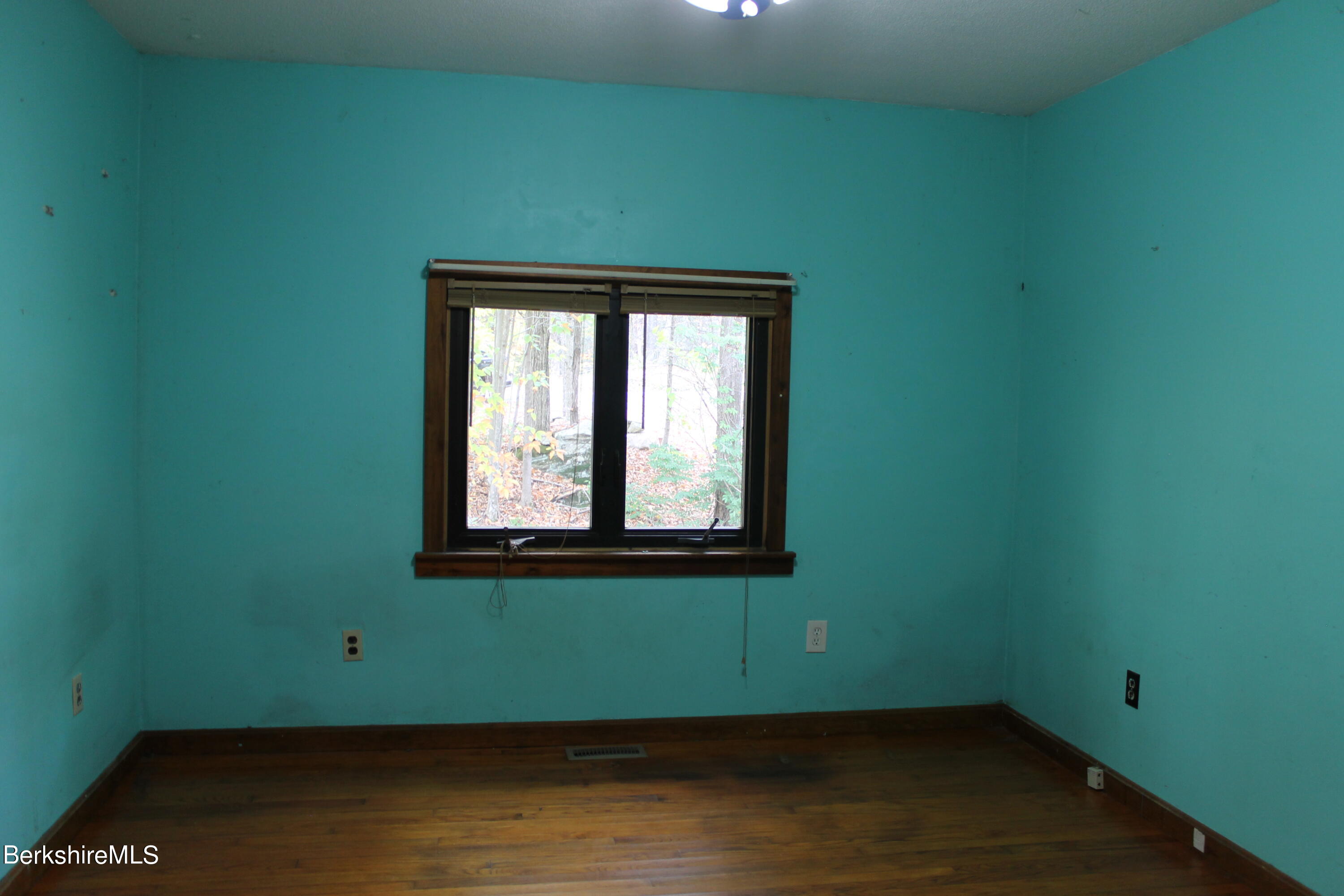 46 East Windsor Road Peru, MA 01235 - Photo 24 of 29 a view of a room with wooden floor and a window