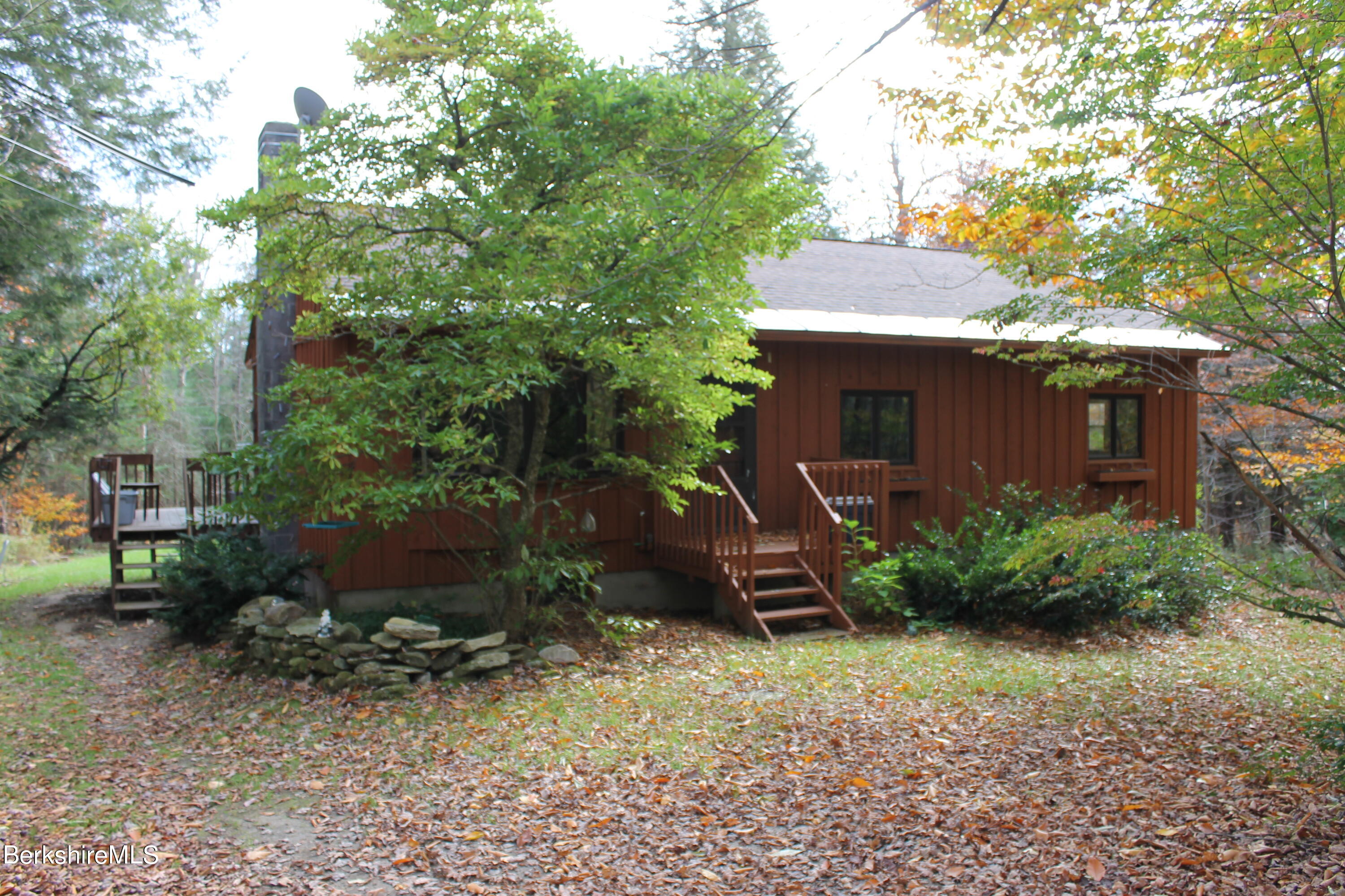 46 East Windsor Road Peru, MA 01235 - Photo 29 of 29 a backyard of a house with plants and tree