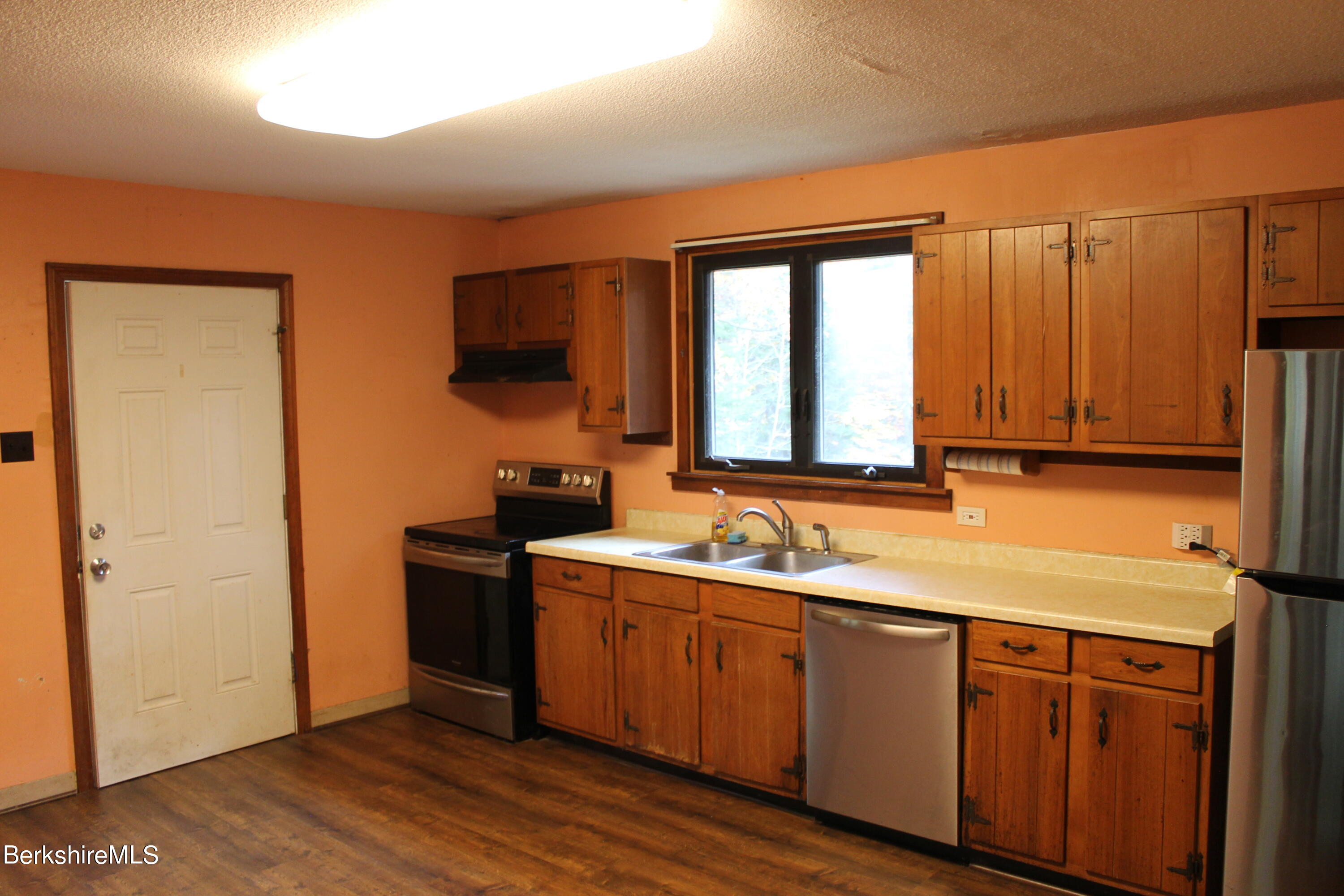 46 East Windsor Road Peru, MA 01235 - Photo 8 of 29 a kitchen with a sink cabinets and wooden floor
