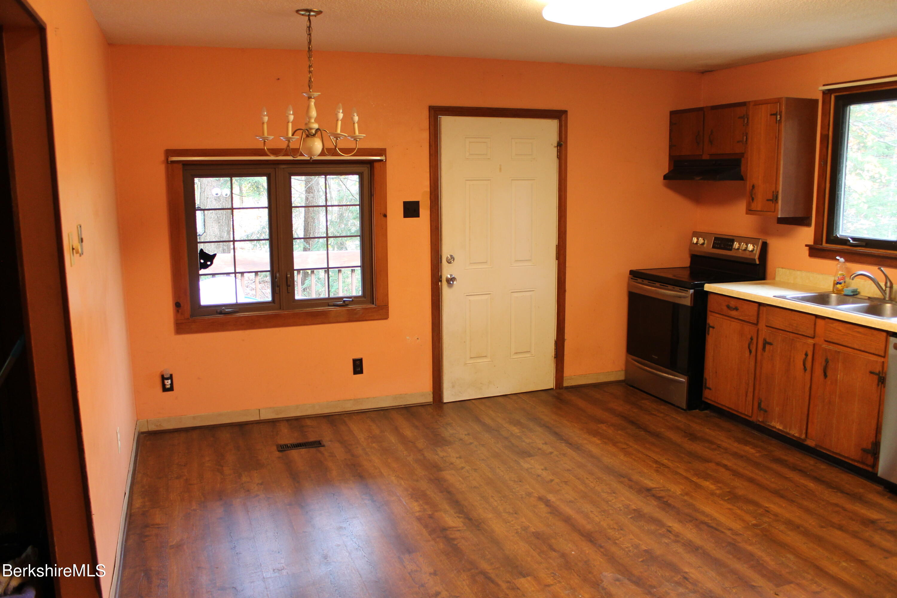 46 East Windsor Road Peru, MA 01235 - Photo 9 of 29 a view of a kitchen with wooden floor and a sink