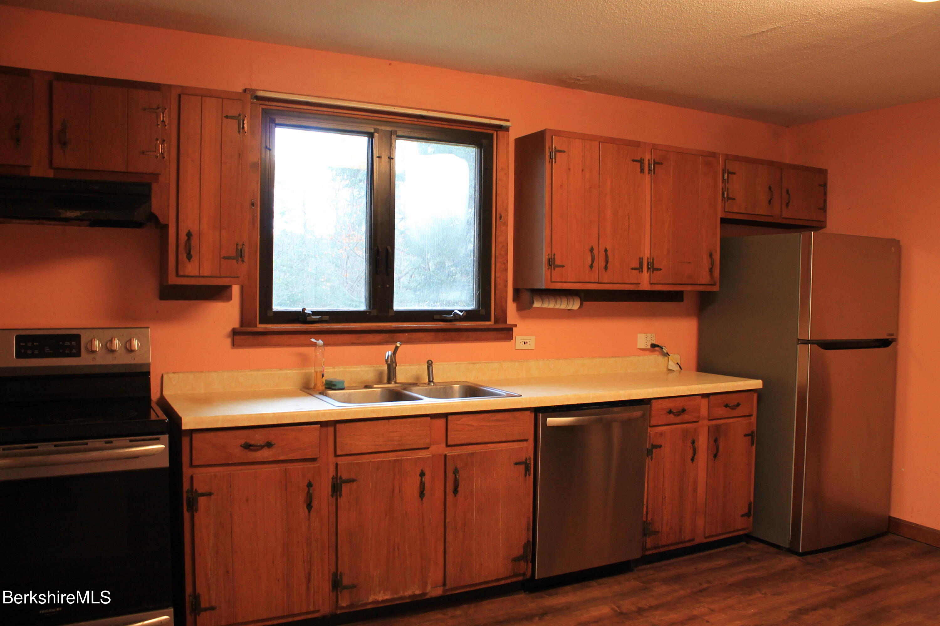 46 East Windsor Road Peru, MA 01235 - Photo 10 of 29 a kitchen with stainless steel appliances granite countertop a sink stove and refrigerator
