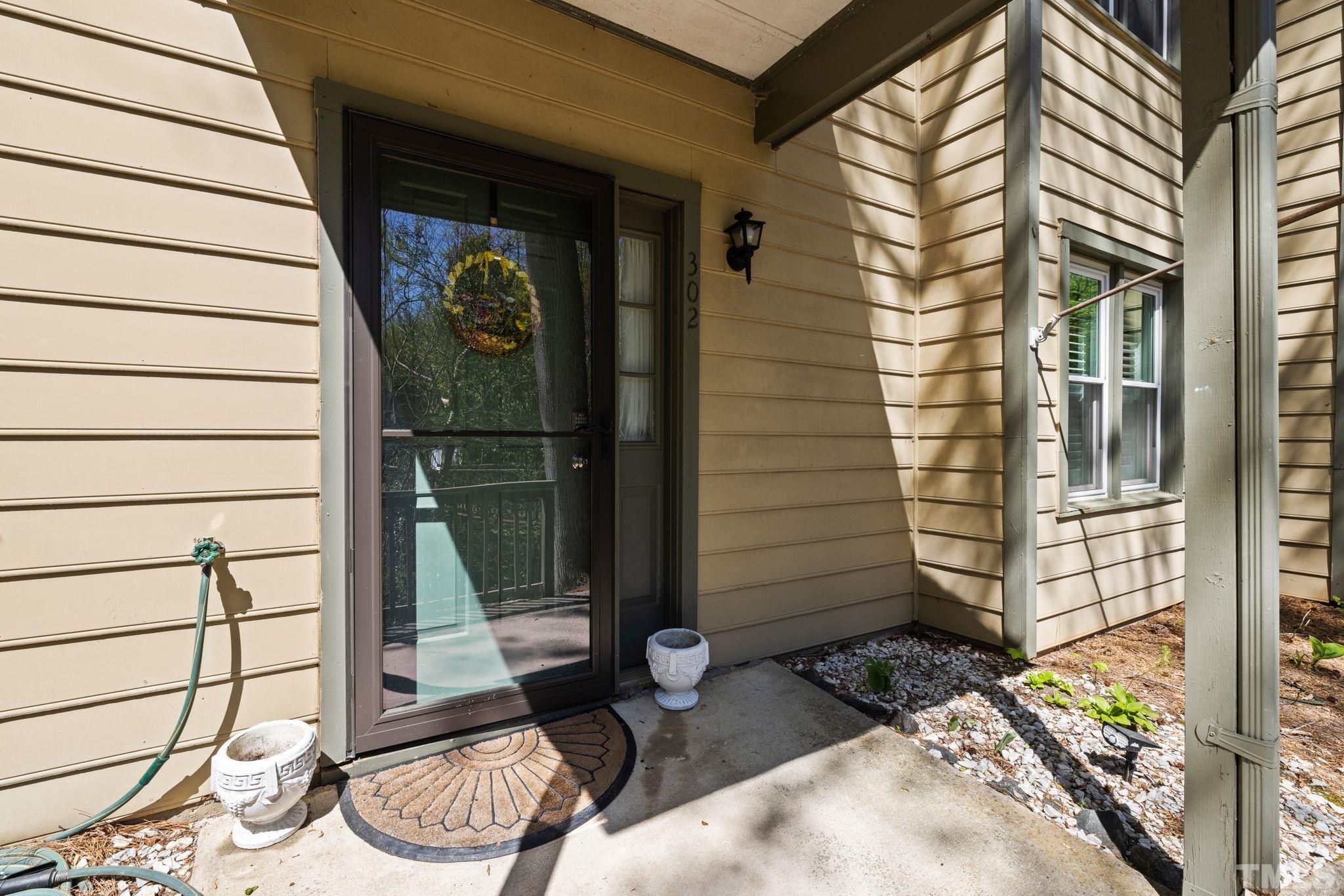 302 Broad Leaf Circle, Unit 302 Raleigh, NC 27613 - Photo 2 of 13 a view of a door of the house