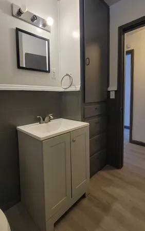 a utility room with a sink dryer and washer