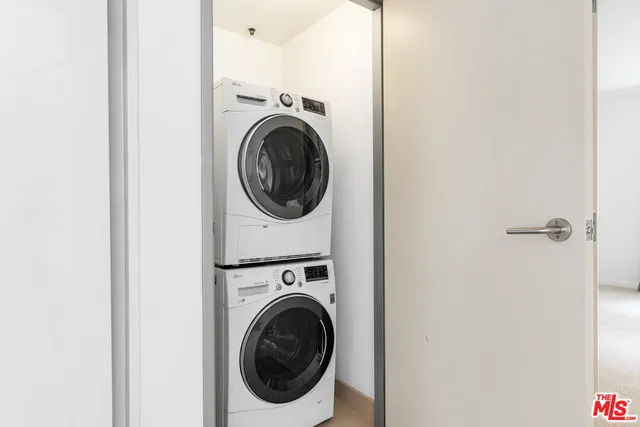 a view of a hallway with washer and dryer