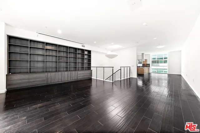 a view of kitchen with furniture and wooden floor