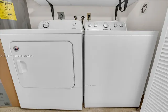 a view of a yard in front of a house with large tree