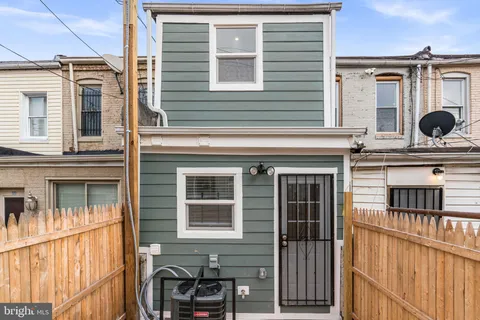 a front view of a house with many windows
