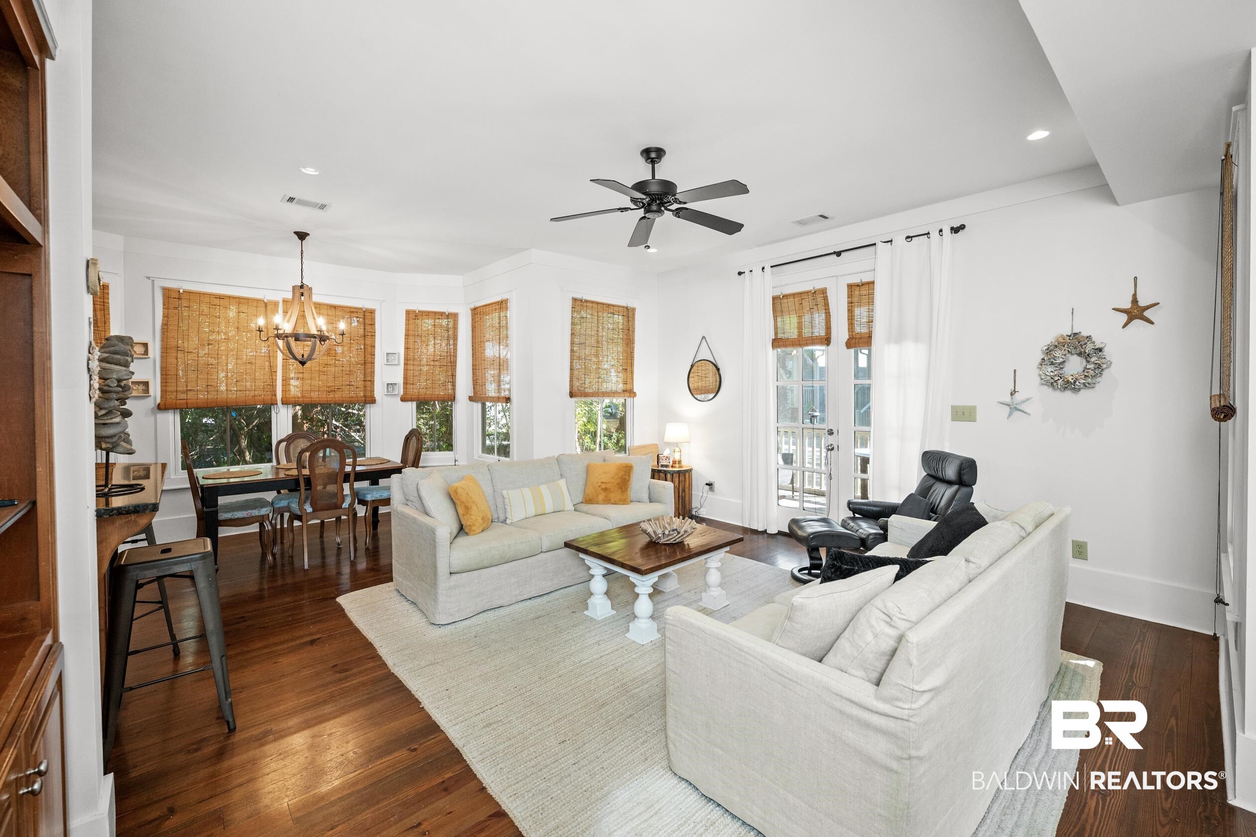 25773 Canal Road, Unit 28 Orange Beach, AL 36561 - Photo 2 of 48 Living area featuring recessed lighting, dark wood finished floors, a chandelier, and ceiling fan