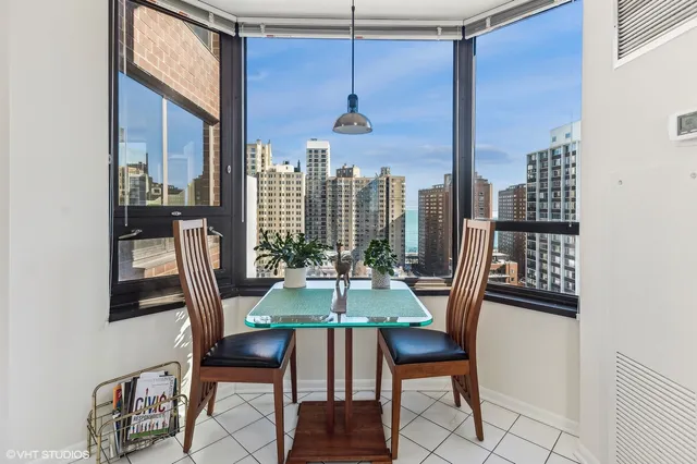 a dining room with furniture and window