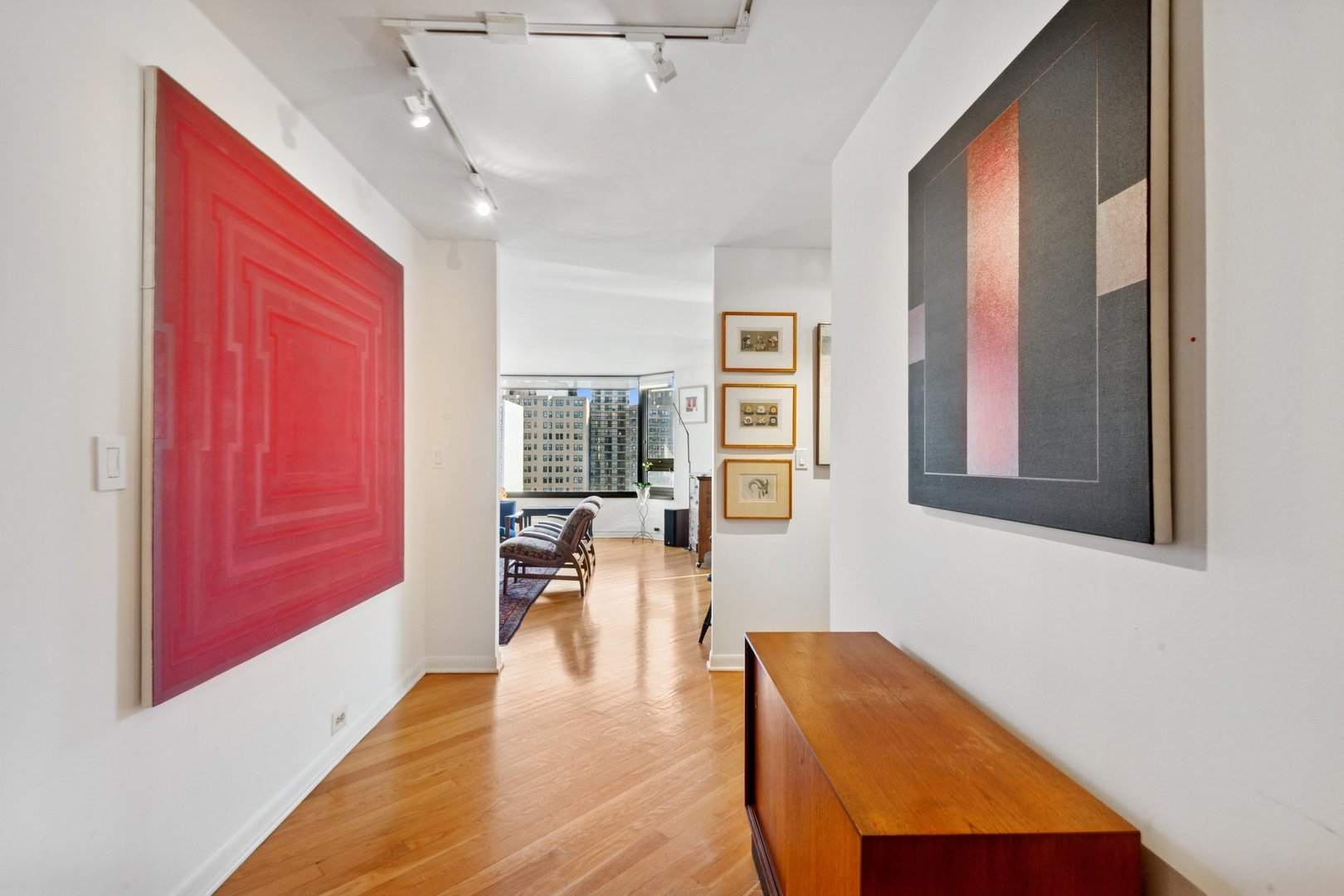 1410 North State Parkway, Unit 18B Chicago, IL 60610 - Photo 2 of 31 a living room with furniture and a window
