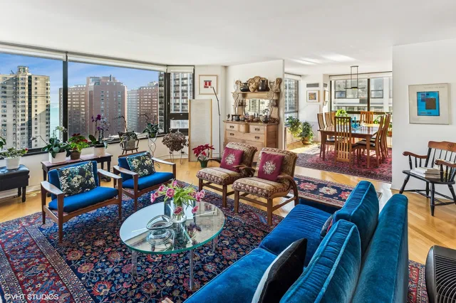 a living room with furniture and a large window