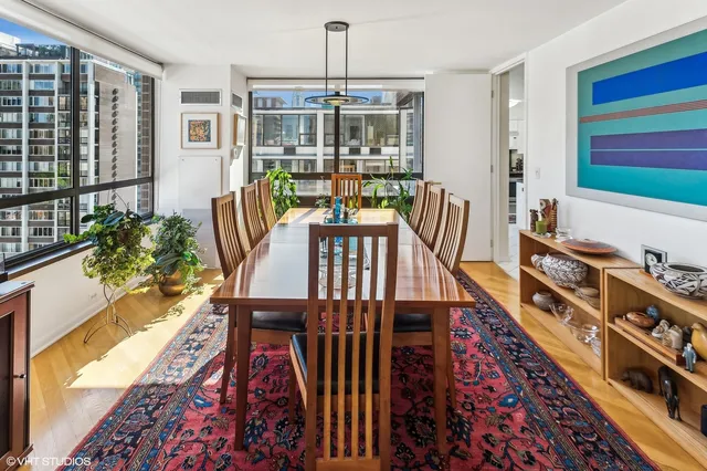 a view of a dining room with furniture window and wooden floor