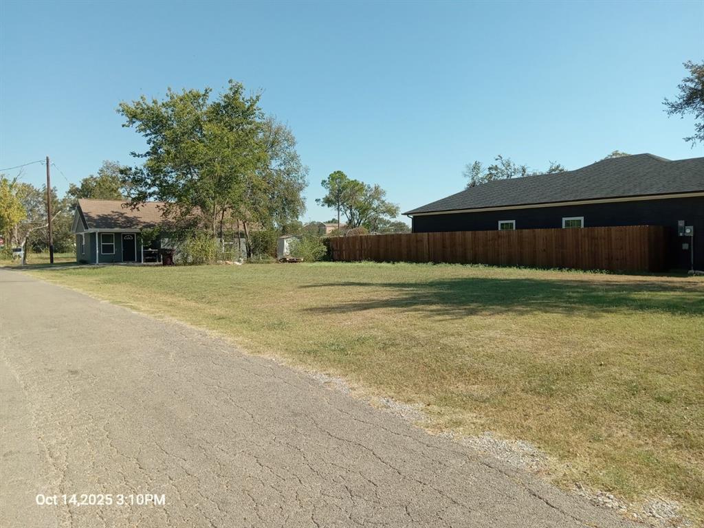 1220 Maple Street Bonham, TX 75418 - Photo 2 of 4 a view of a yard