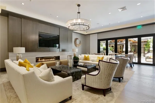 a living room with furniture fireplace and a flat screen tv