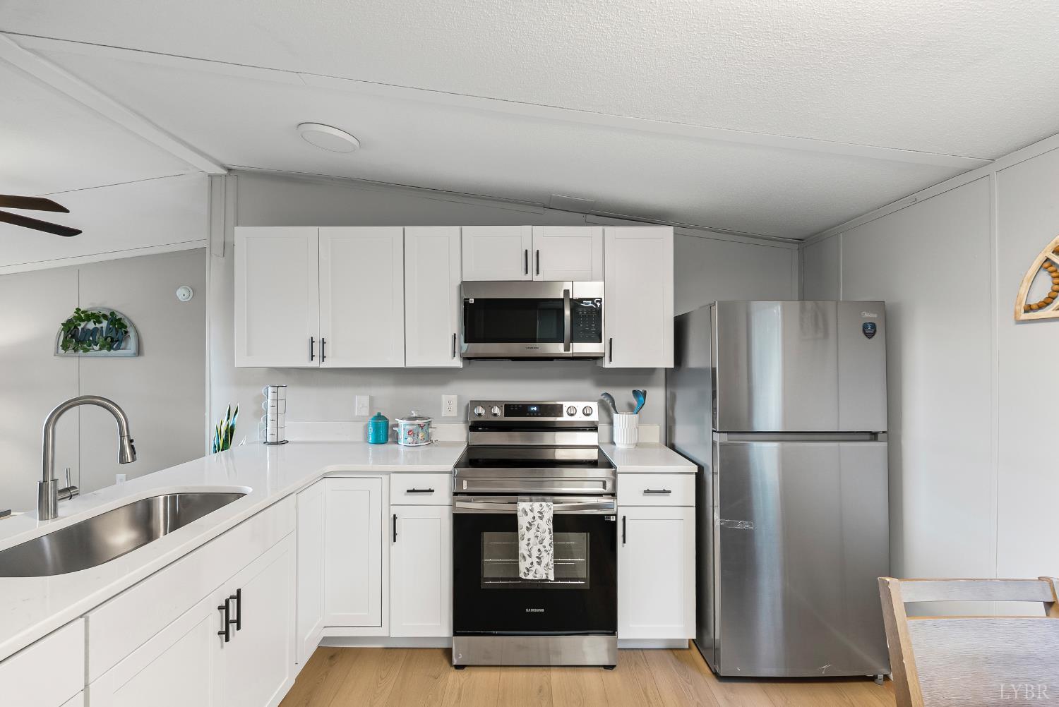 2141 Gap Road Chatham, VA 24531 - Photo 11 of 39 a kitchen with stainless steel appliances a refrigerator stove and microwave